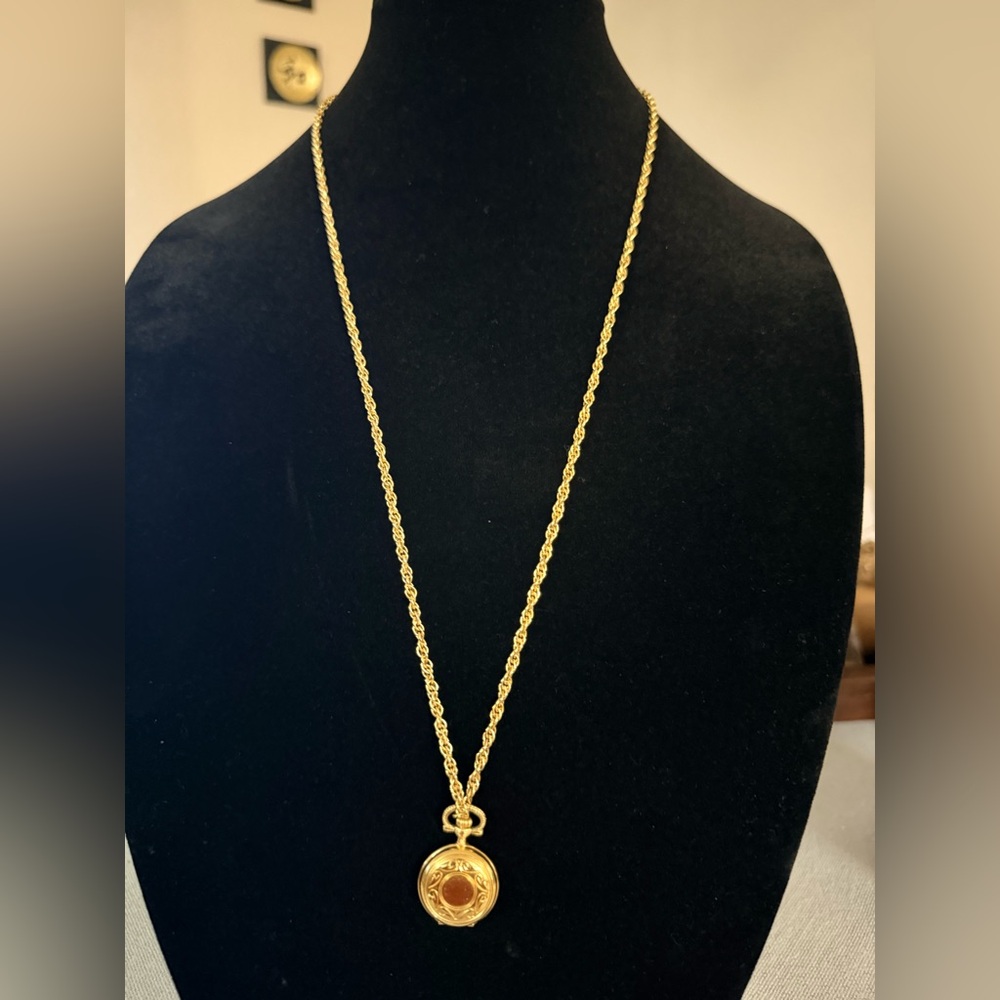 Vintage gold tone Colibri quartz pocket watch on a gold tone Necklace 29” long